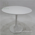 white fiberglass Eero Saarinen tulip round dining table
